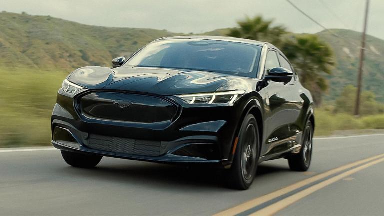 2024 Ford Mustang Mach E Premium driving on the road.